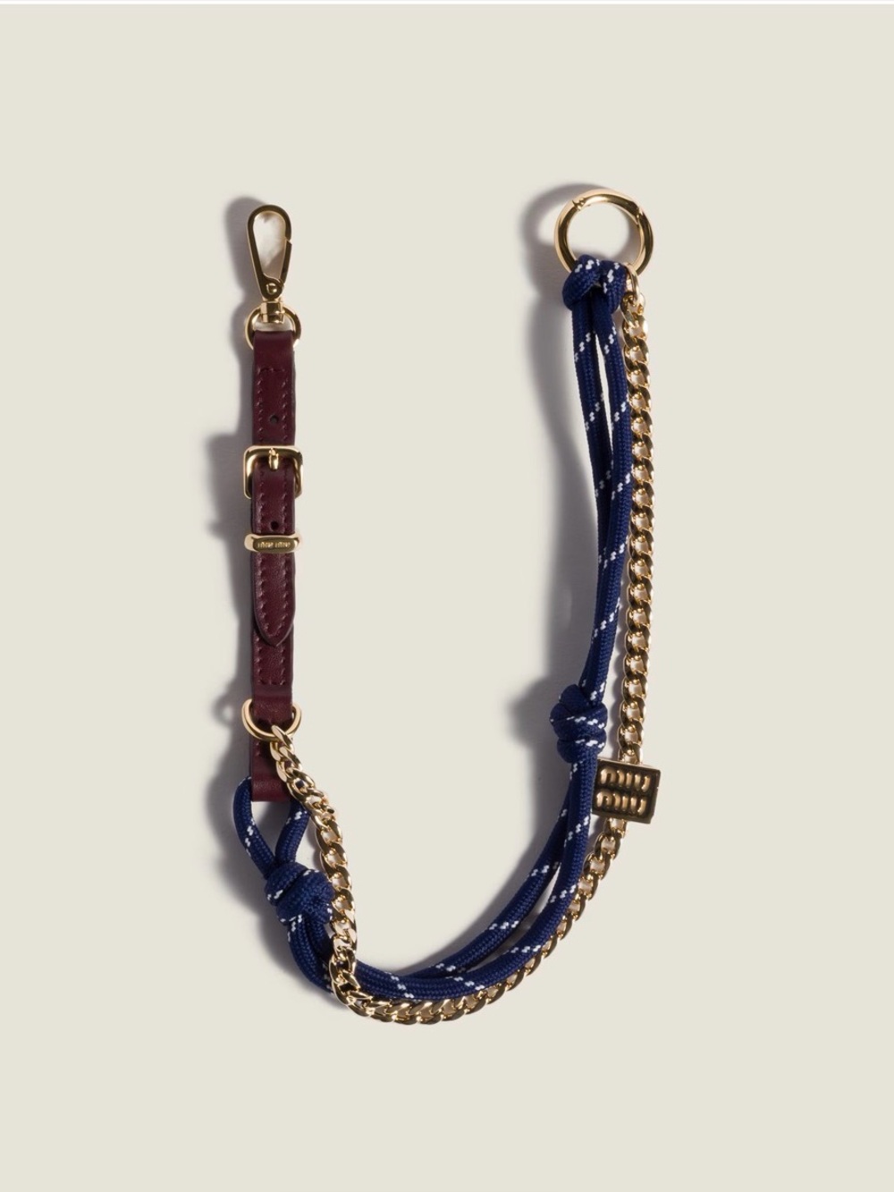 Miu Miu leather, cord and metal trick keyring charm